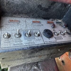 IMG_1326 - Montana Auctions by Kevin Hill Dusty farm machinery control panel with toggle switches labeled Twine, Clutch, Gate, Eject, and a Full Bale Alarm.