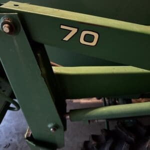 IMG_1396 2 - Montana Auctions by Kevin Hill Green metal agricultural equipment with the number '70' decal prominently displayed.