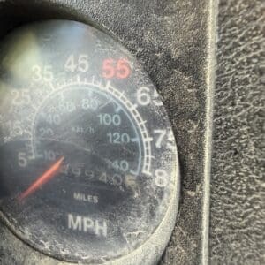 IMG_6535 - Montana Auctions by Kevin Hill Close-up of a dusty car speedometer showing mph, needle near 0, with 55 highlighted in red.