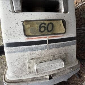 IMG_6653 - Montana Auctions by Kevin Hill Weathered parking meter covered in dust, display shows 60 in the window outdoors on a dirt surface.