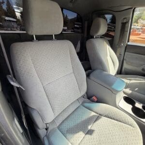 IMG_6675 - Montana Auctions by Kevin Hill Interior of a pickup truck with two front cloth seats and center console visible from the open driver’s side door