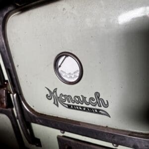 Old Monarch Malleable furnace door with round gauge
