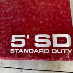 Close-up of a red box label that reads '5' SD STANDARD DUTY' in white letters.